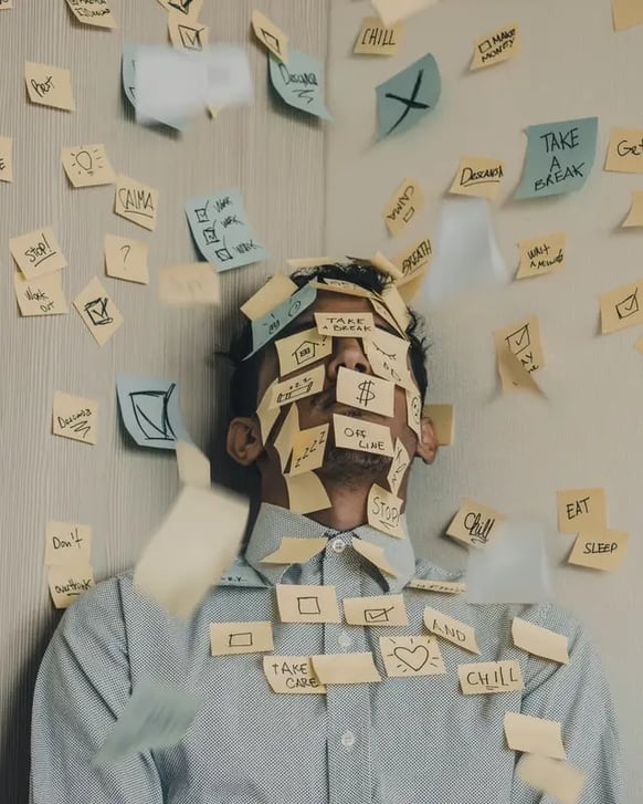 overwhelmed man with stickies